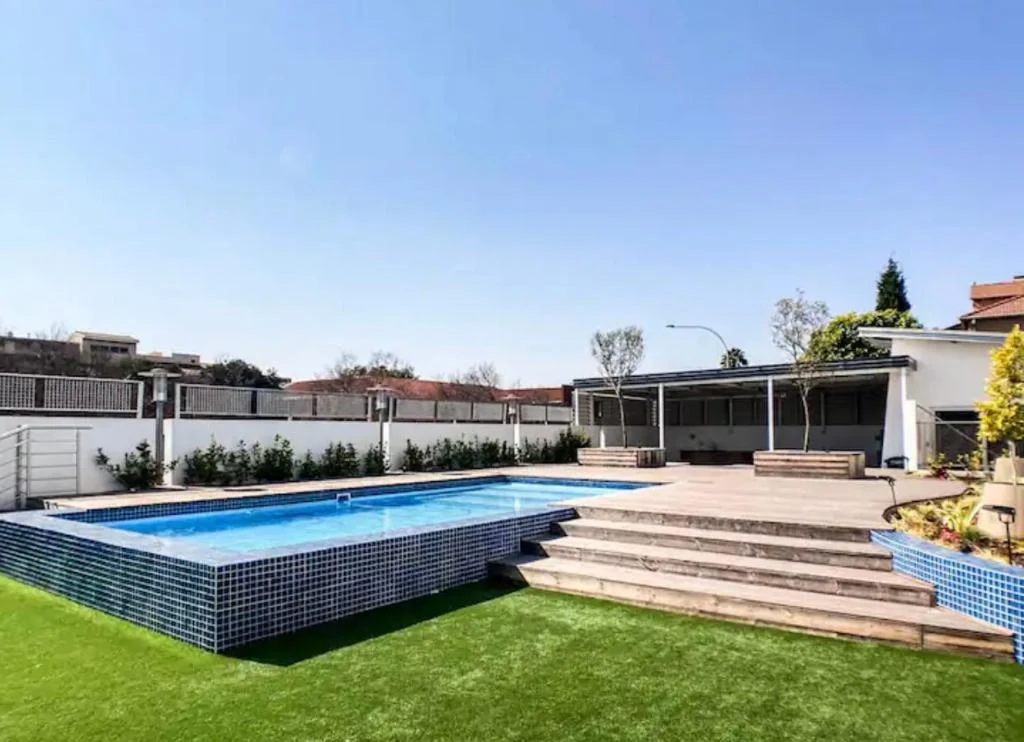 Outdoor swimming pool and landscaped terrace